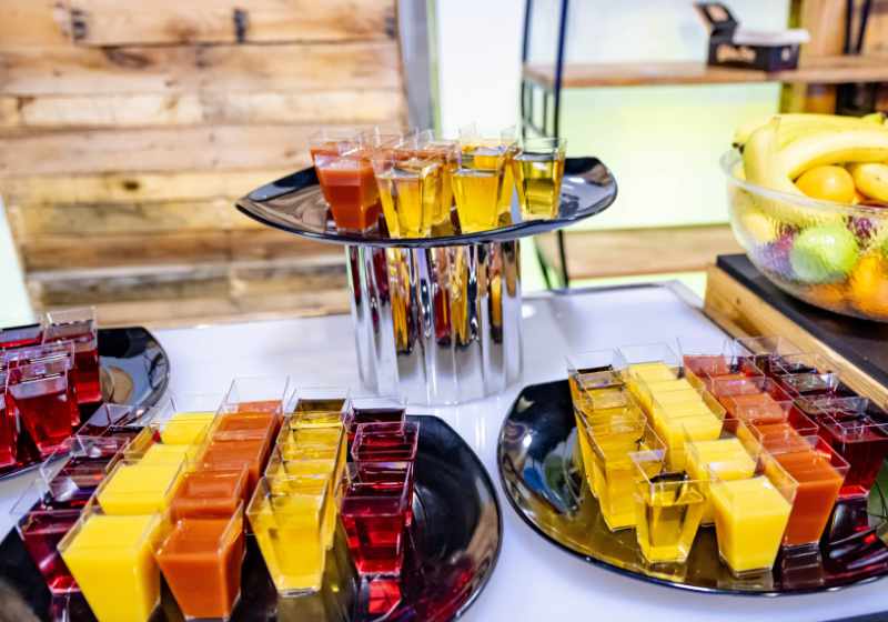 A table with different colored drinks